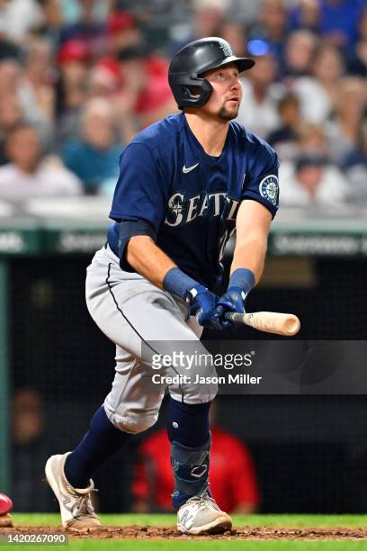 Cal Raleigh of the Seattle Mariners watches a three-run home run during the sixth inning against the Cleveland Guardians at Progressive Field on...