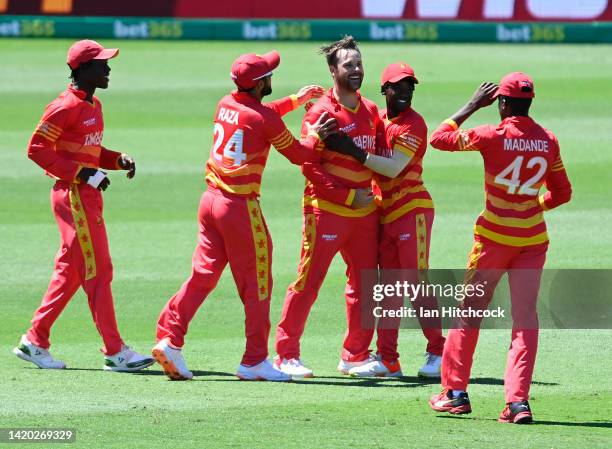 Ryan Burl of Zimbabwe celebrates after taking the wicket of Glenn Maxwell of Australia during game three of the One Day International series between...