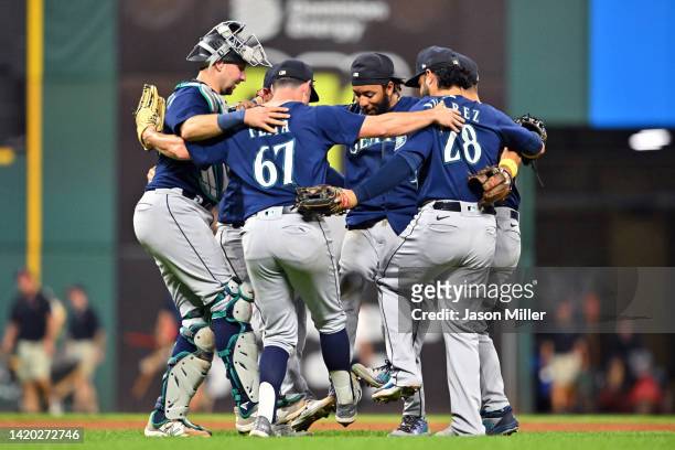 The Seattle Mariners infielders celebrate after defeating the Cleveland Guardians at Progressive Field on September 02, 2022 in Cleveland, Ohio. The...
