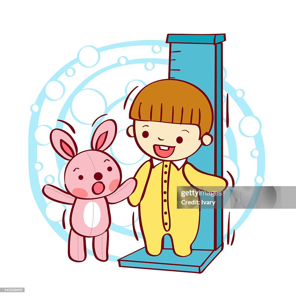 Child standing on height chart with teddy bear