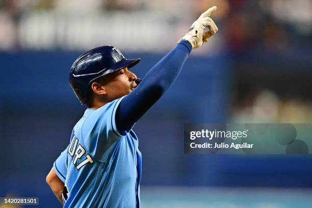 Christian Bethancourt of the Tampa Bay Rays points up after hitting a 2-run home run in the seventh inning against the New York Yankees at Tropicana...