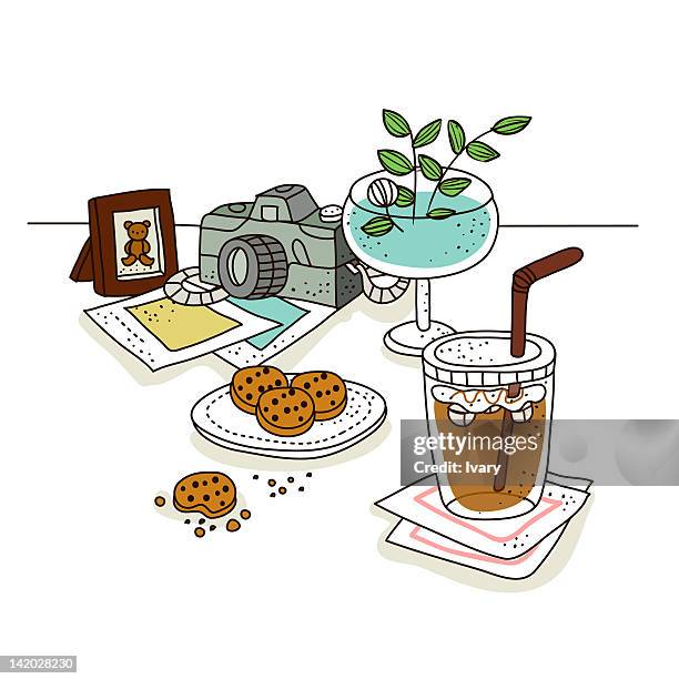 cold coffee with cookie and camera in background - empty white plate stock illustrations