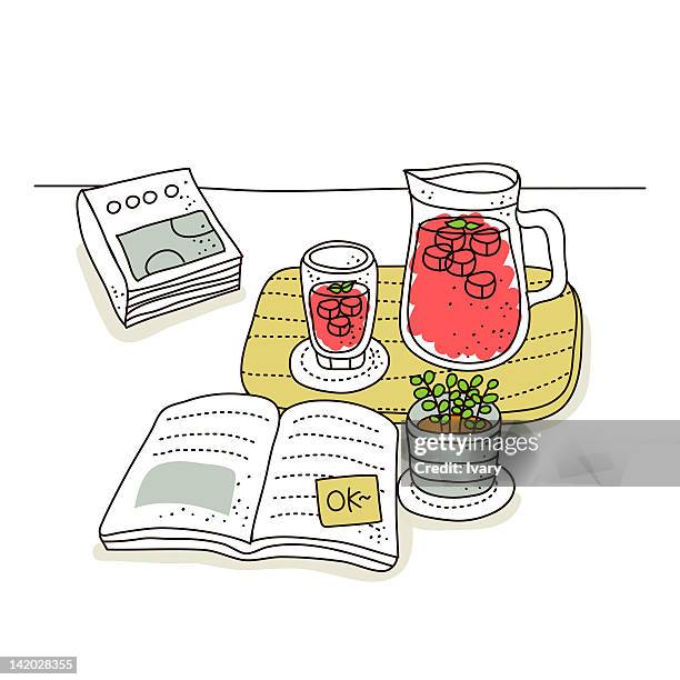 juice on tray with book on white background - sugar cube stock illustrations