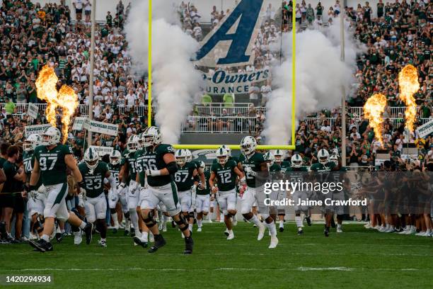 The Michigan State Spartans take the field prior to their game against the Western Michigan Broncos at Spartan Stadium on September 2, 2022 in East...