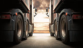 Semi TrailerTrucks on Parking with The Sunset Sky. Shipping Container Truck. Delivery Transit. Engine Diesel Truck Tractor. Industry Freight Trucks Logistics Cargo Transport.