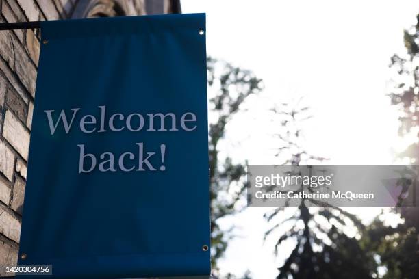 outdoor “welcome back!” sign on school campus - welcome text stock pictures, royalty-free photos & images