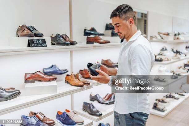 these are a bit expensive - shoe shopping stock pictures, royalty-free photos & images