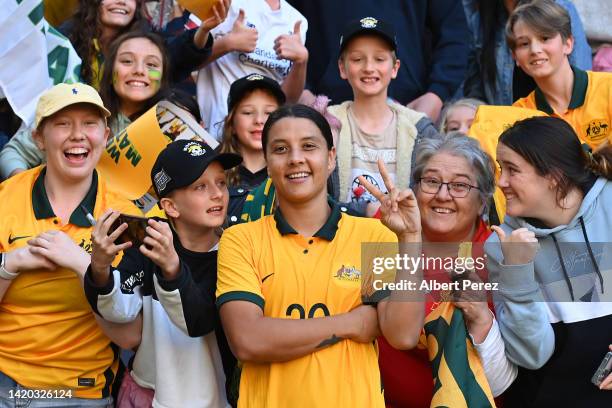 Sam Kerr of Australia poses for a photo with fans after the International Women's Friendly match between the Australia Matildas and Canada at Suncorp...