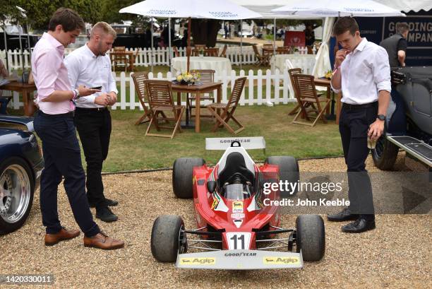 Visitors view a child's replica of Niki Lauda's Ferrari 312T formula one car built in the 1970s during the Concours d'Elegance at Hampton Court...