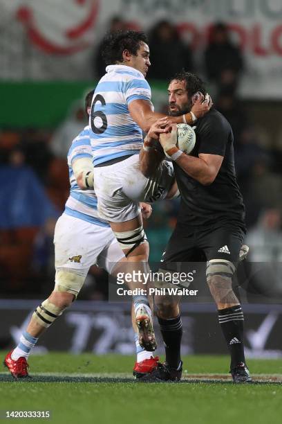 Sam Whitelock of the New Zealand All Blacks is tackled by Santiago Grondona of Argentina during The Rugby Championship match between the New Zealand...