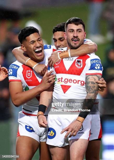 Jack Bird of the Dragons celebrates scoring a try with team mates during the round 25 NRL match between the St George Illawarra Dragons and the...