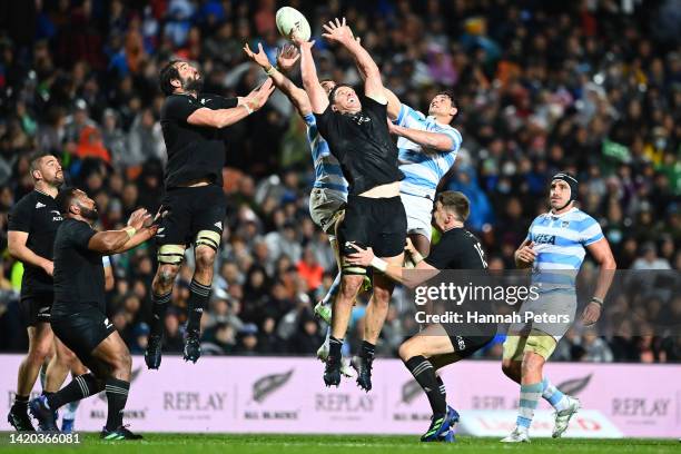 Sam Whitelock and Scott Barrett of the All Blacks compete for the high ball during The Rugby Championship match between the New Zealand All Blacks...