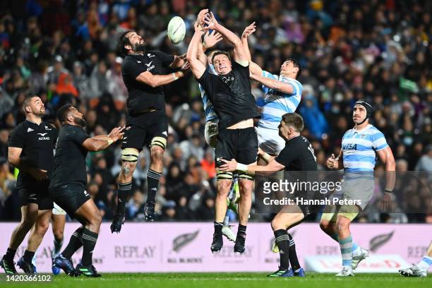 Sam Whitelock and Scott Barrett of the All Blacks compete for the high ball during The Rugby Championship match between the New Zealand All Blacks...
