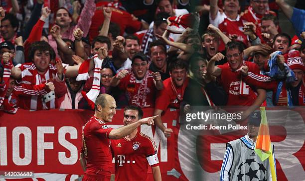 Arjen Robben of Muenchen celebrates with his team mate Philipp Lahm after scoring his team's second goal during the UEFA Champions League Quarter...