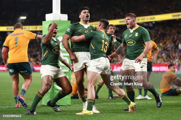 Damian de Allende of the Springboks celebrates with team mates after scoring a try during The Rugby Championship match between the Australia...