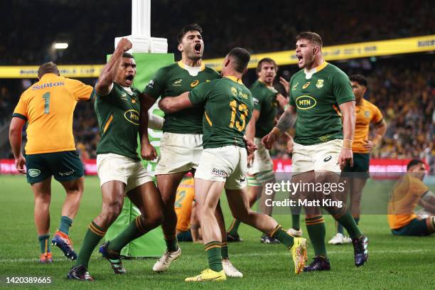 Damian de Allende of the Springboks celebrates with team mates after scoring a try during The Rugby Championship match between the Australia...