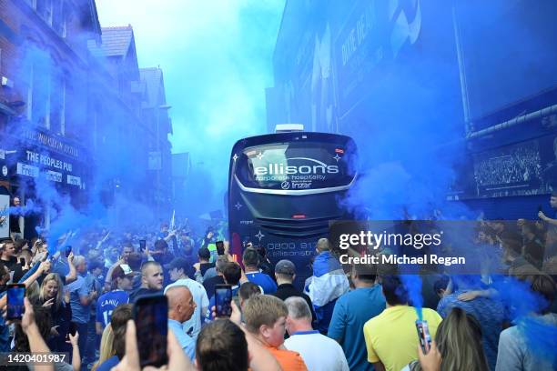 Everton fans welcome their team coach outside the stadium prior to the Premier League match between Everton FC and Liverpool FC at Goodison Park on...