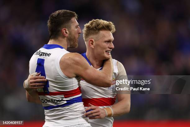 Marcus Bontempelli and Adam Treloar of the Bulldogs celebrate a goal during the AFL First Elimination Final match between the Fremantle Dockers and...