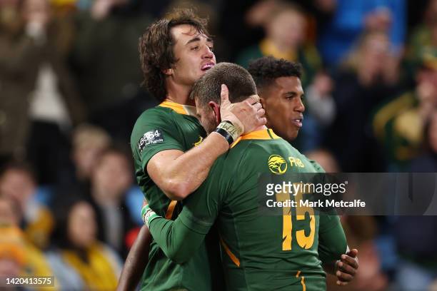 Franco Mostert of the Springboks celebrates with team mate Willie le Roux of the Springboks after scoring a try during The Rugby Championship match...