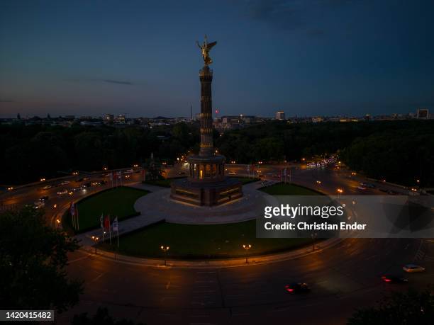 In this aerial view cars drive around the unlit Victory Column, one of Berlin's premiere landmarks, on the second day of a new law to save energy...