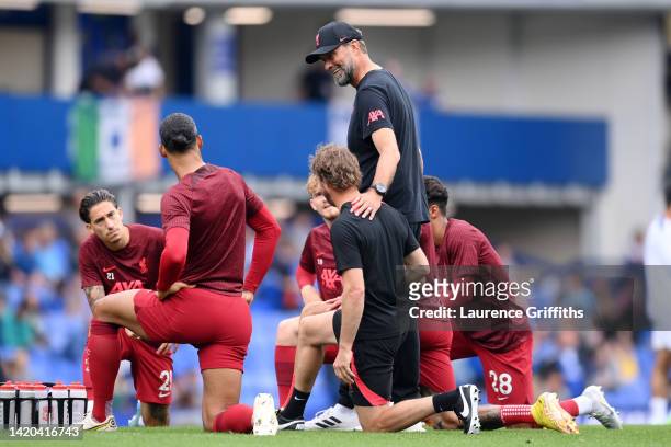 Juergen Klopp, Manager of Liverpool gives their team instructions in the warm up prior to the Premier League match between Everton FC and Liverpool...