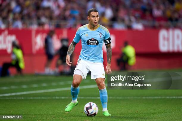 Hugo Mallo of RC Celta controls the ball during the LaLiga Santander match between Girona FC and RC Celta at Montilivi Stadium on August 26, 2022 in...