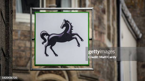 The Lloyds Bank logo is displayed outside a branch of the English and Welsh commercial and retail bank on Penzance High Street on August 15, 2022 in...