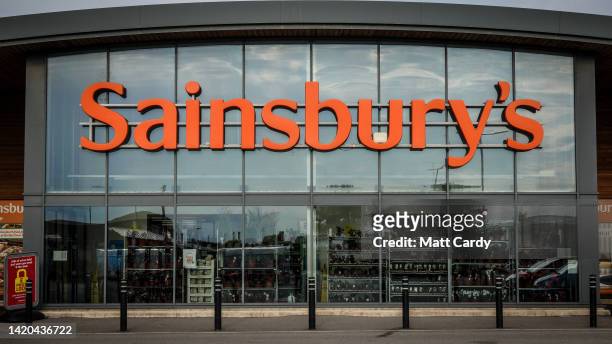 Sainsbury's logo is displayed outside a branch of the supermarket retailer Sainsbury's on August 15, 2022 in Cornwall, England. The British retailer,...