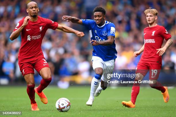 Demarai Gray of Everton is challenged by Fabinho of Liverpool during the Premier League match between Everton FC and Liverpool FC at Goodison Park on...