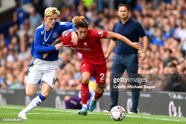 Kostas Tsimikas of Liverpool battles for possession with Anthony Gordon of Everton during the Premier League match between Everton FC and Liverpool...