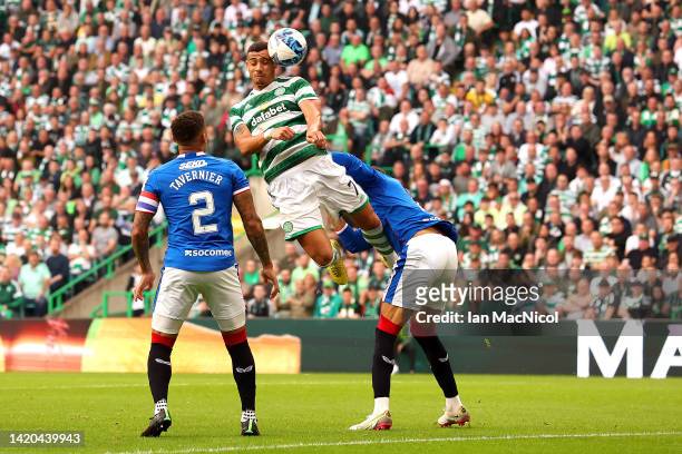 Giorgos Giakoumakis of Celtic jumps for the ball with Connor Goldson of Rangers during the Cinch Scottish Premiership match between Celtic FC and...