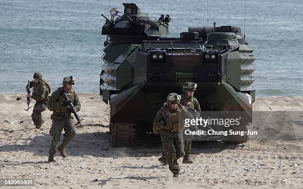 Marine soldiers from 31st Marine Expeditionary Unit, Battalion landing team deployed from Okinawa, Japan, exit an Amphibious Assault Vehicle during...