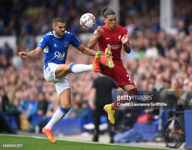 Darwin Nunez of Liverpool is challenged by Conor Coady of Everton during the Premier League match between Everton FC and Liverpool FC at Goodison...