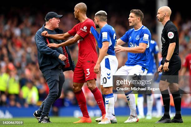 Fan confronts the referee after a goal by Conor Coady of Everton was ruled out by VAR for offside during the Premier League match between Everton FC...