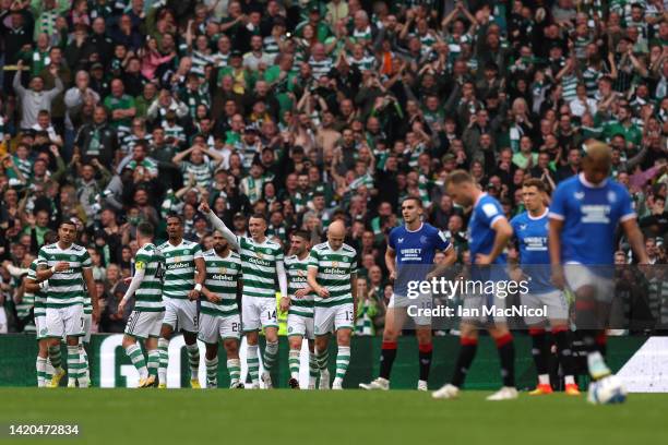 David Turnbull of Celtic celebrates with teammates after scoring their team's fourth goal during the Cinch Scottish Premiership match between Celtic...
