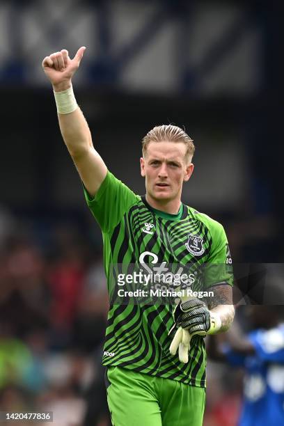 Jordan Pickford of Everton acknowledges the fans after their sides draw during the Premier League match between Everton FC and Liverpool FC at...
