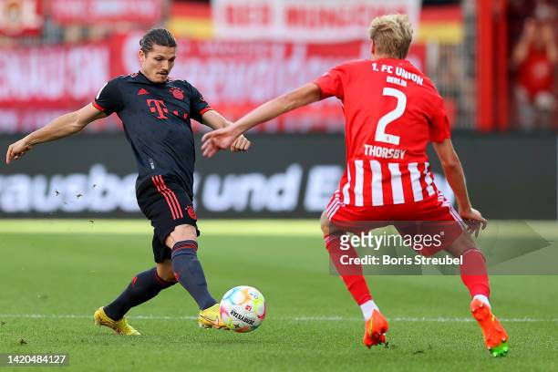 Marcel Sabitzer of Bayern Munich is put under pressure by Morten Thorsby of FC Union Berlin during the Bundesliga match between 1. FC Union Berlin...