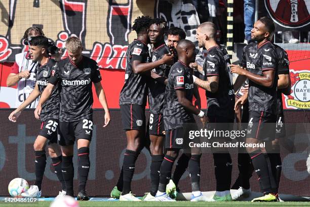 Kerem Demirbay of Bayer Leverkusen celebrates with teammates after scoring their team's first goal during the Bundesliga match between Bayer 04...