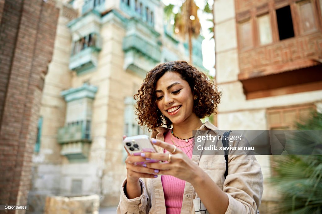 Candid portrait of young Middle Eastern digital native