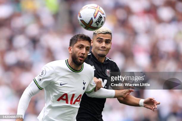 Rodrigo Bentancur of Tottenham Hotspur battles for possession with Andreas Pereira of Fulham during the Premier League match between Tottenham...