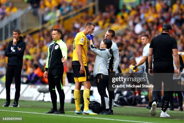 Sasa Kalajdzic of Wolverhampton Wanderers receives medical treatment during the Premier League match between Wolverhampton Wanderers and Southampton...