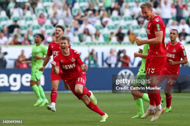 Florian Kainz of 1.FC Köln celebrates scoring their side's third goal from a penalty during the Bundesliga match between VfL Wolfsburg and 1. FC Köln...