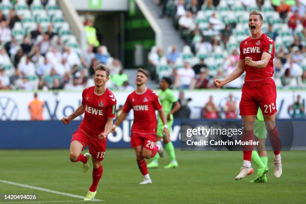 Florian Kainz of 1.FC Köln celebrates scoring their side's third goal from a penalty during the Bundesliga match between VfL Wolfsburg and 1. FC Köln...