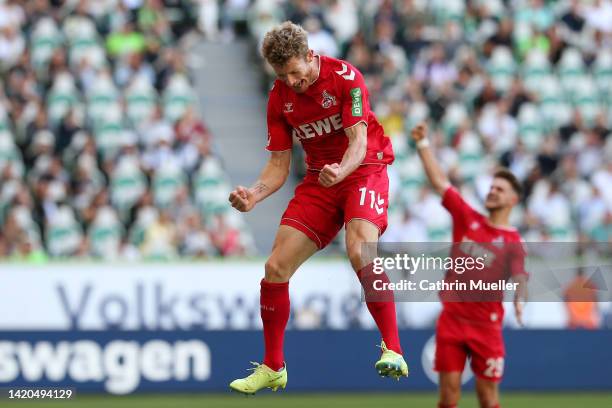 Florian Kainz of 1.FC Köln celebrates scoring their side's third goal from a penalty during the Bundesliga match between VfL Wolfsburg and 1. FC Köln...