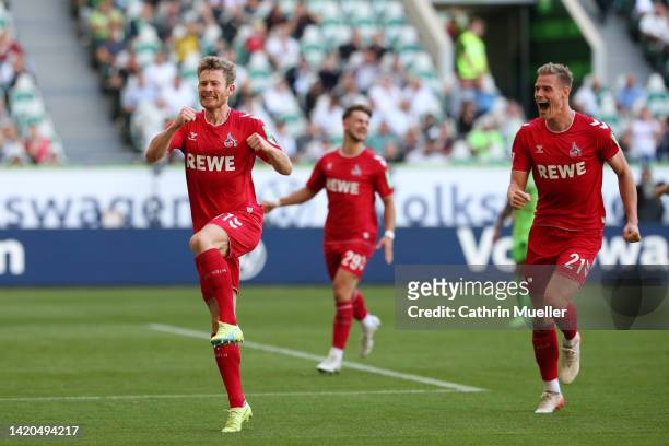 Florian Kainz of 1.FC Köln celebrates scoring their side's third goal from a penalty during the Bundesliga match between VfL Wolfsburg and 1. FC Köln...