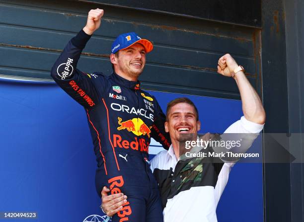 Pole position qualifier Max Verstappen of the Netherlands and Oracle Red Bull Racing celebrates with Rico Verhoeven in parc ferme during qualifying...