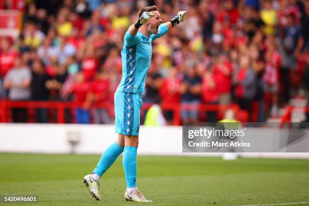 Dean Henderson of Nottingham Forest celebrates after teammate Cheikhou Kouyate scores their team's first goal during the Premier League match between...