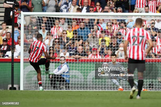 Ivan Toney of Brentford scores their side's first goal from a penalty as Illan Meslier of Leeds United attempts to make a save during the Premier...