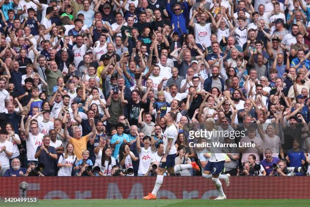 Tottenham Hotspur fans celebrate as Pierre-Emile Hojbjerg of Tottenham Hotspur celebrates after scoring their team's first goal during the Premier...
