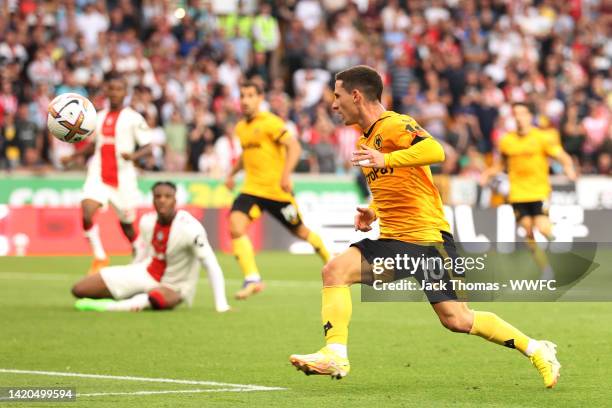 Daniel Podence of Wolverhampton Wanderers scores their team's first goal during the Premier League match between Wolverhampton Wanderers and...